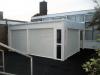 White enclosed canopy with roller shutters